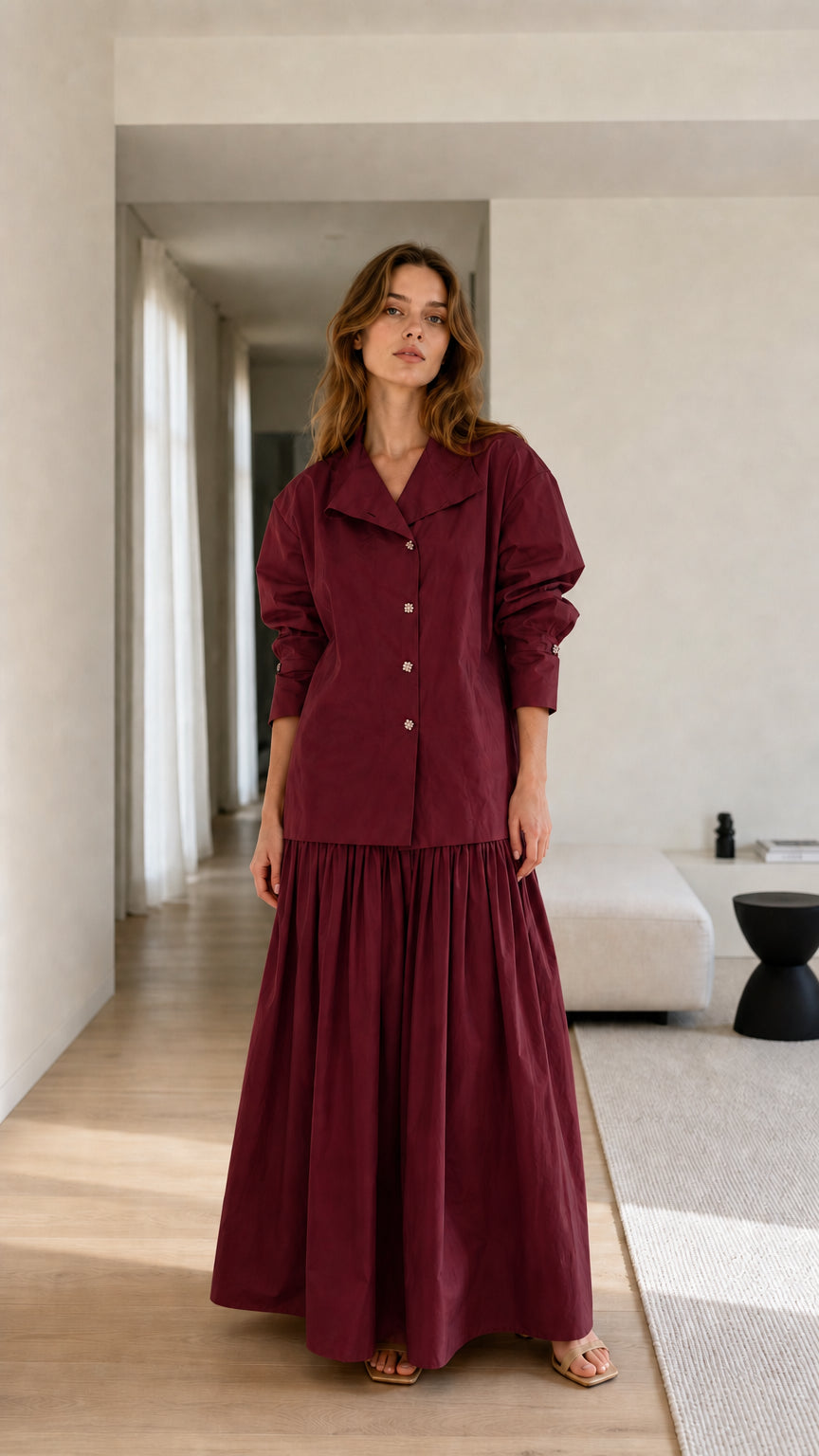 Model wearing burgundy two-piece set