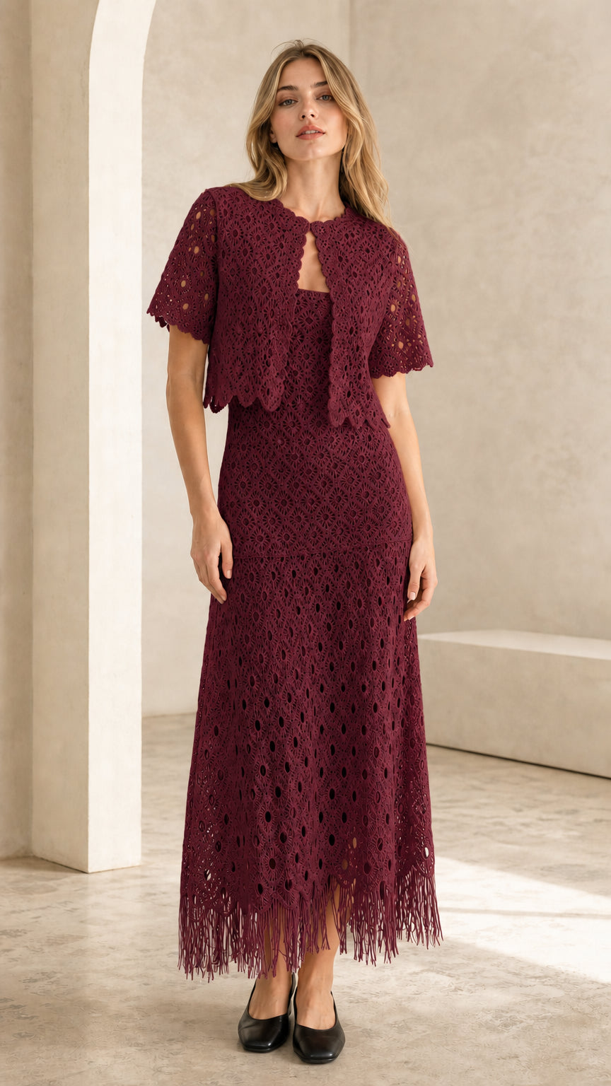 Front view of burgundy crochet lace two-piece set on model