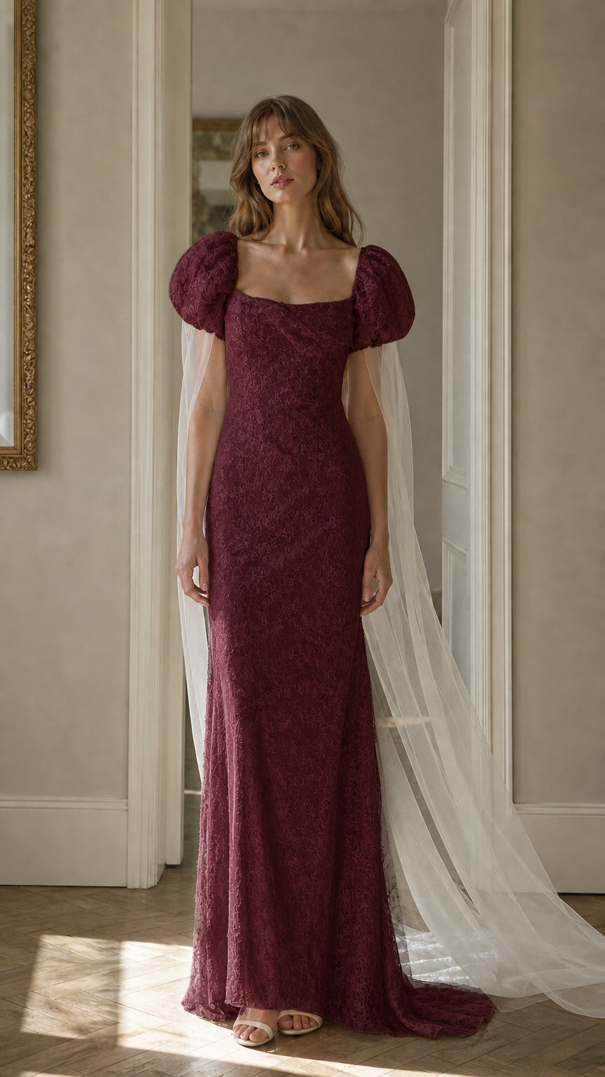 Front view of burgundy lace maxi dress with cape