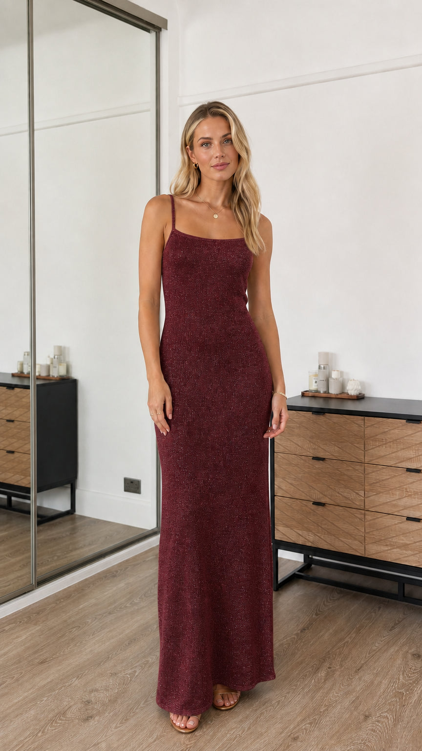 Model wearing burgundy sequin spaghetti strap maxi dress