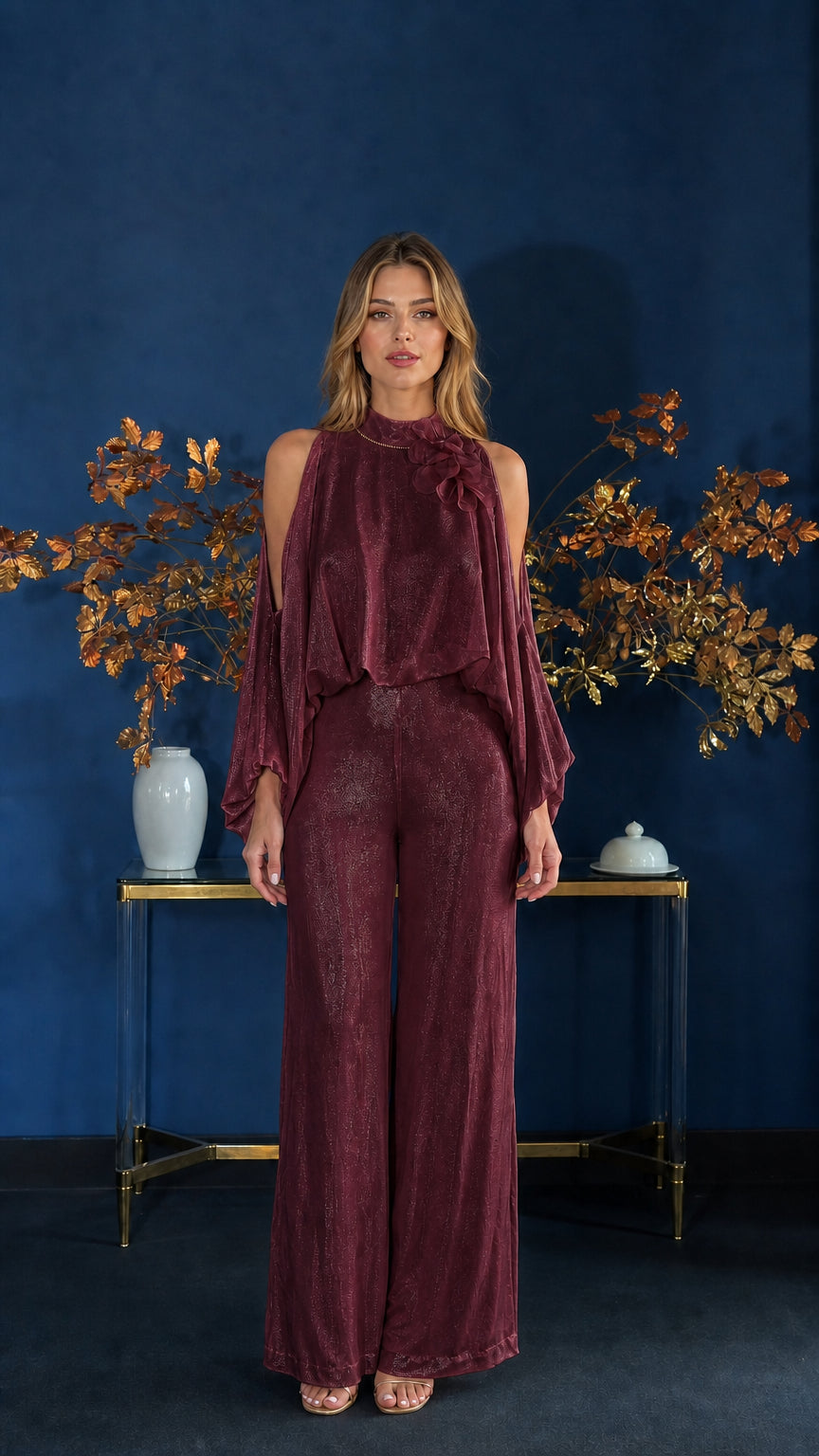 Front view of model wearing burgundy cold-shoulder jumpsuit