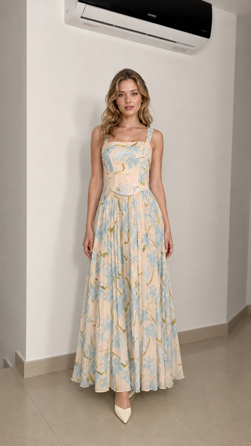 Model wearing cream floral maxi dress