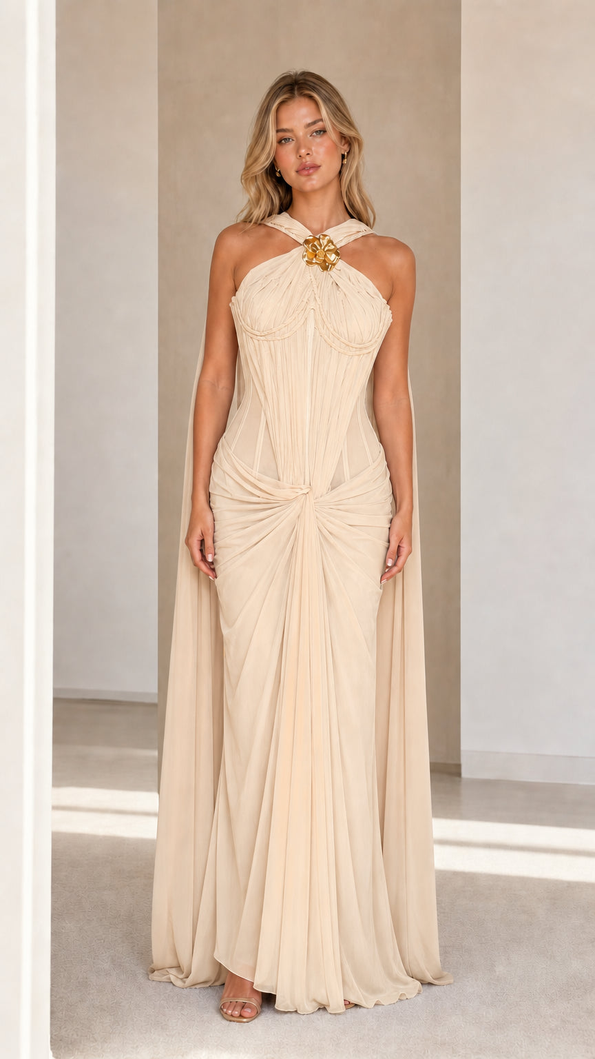 Model wearing champagne evening cape maxi dress