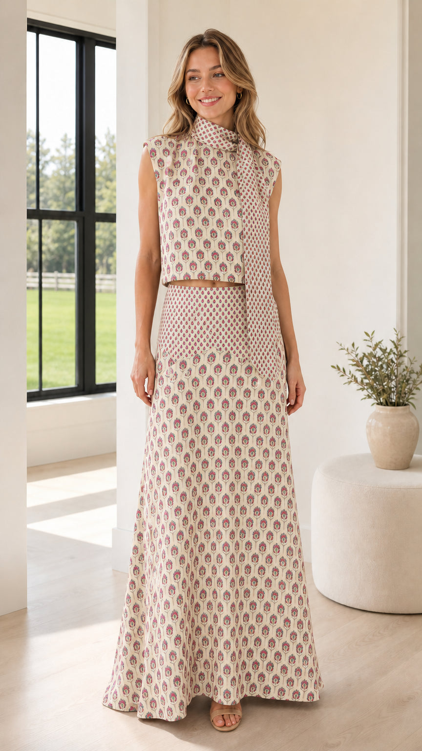 Front view of model wearing beige patterned two-piece set