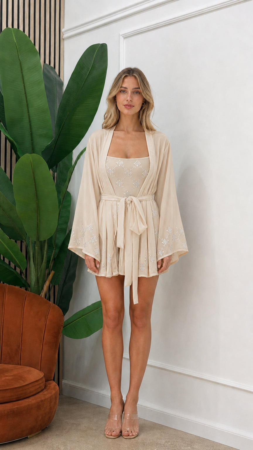 Front view of model wearing beige embellished three-piece kimono set