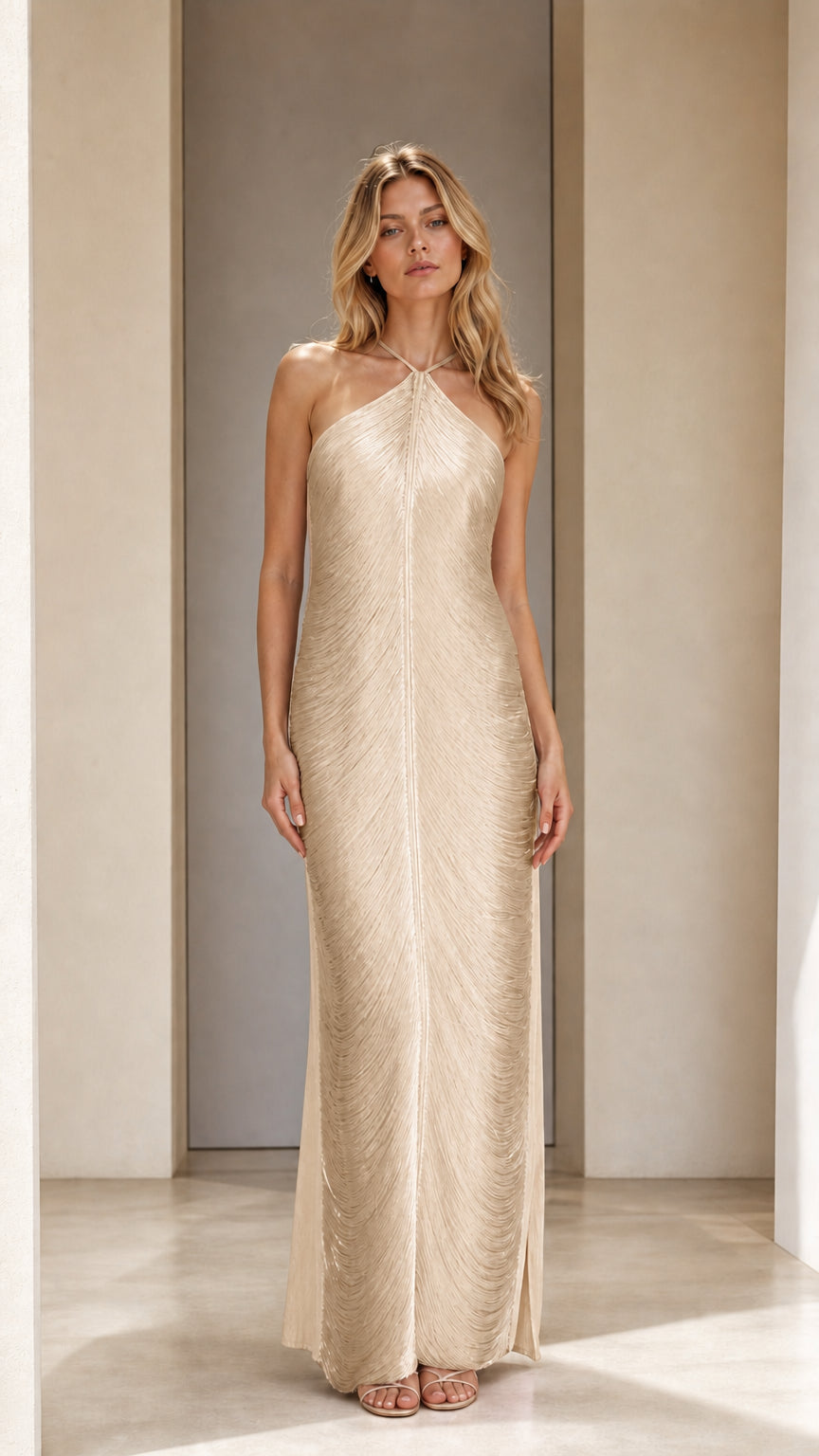 Model wearing champagne halter neck pleated maxi dress