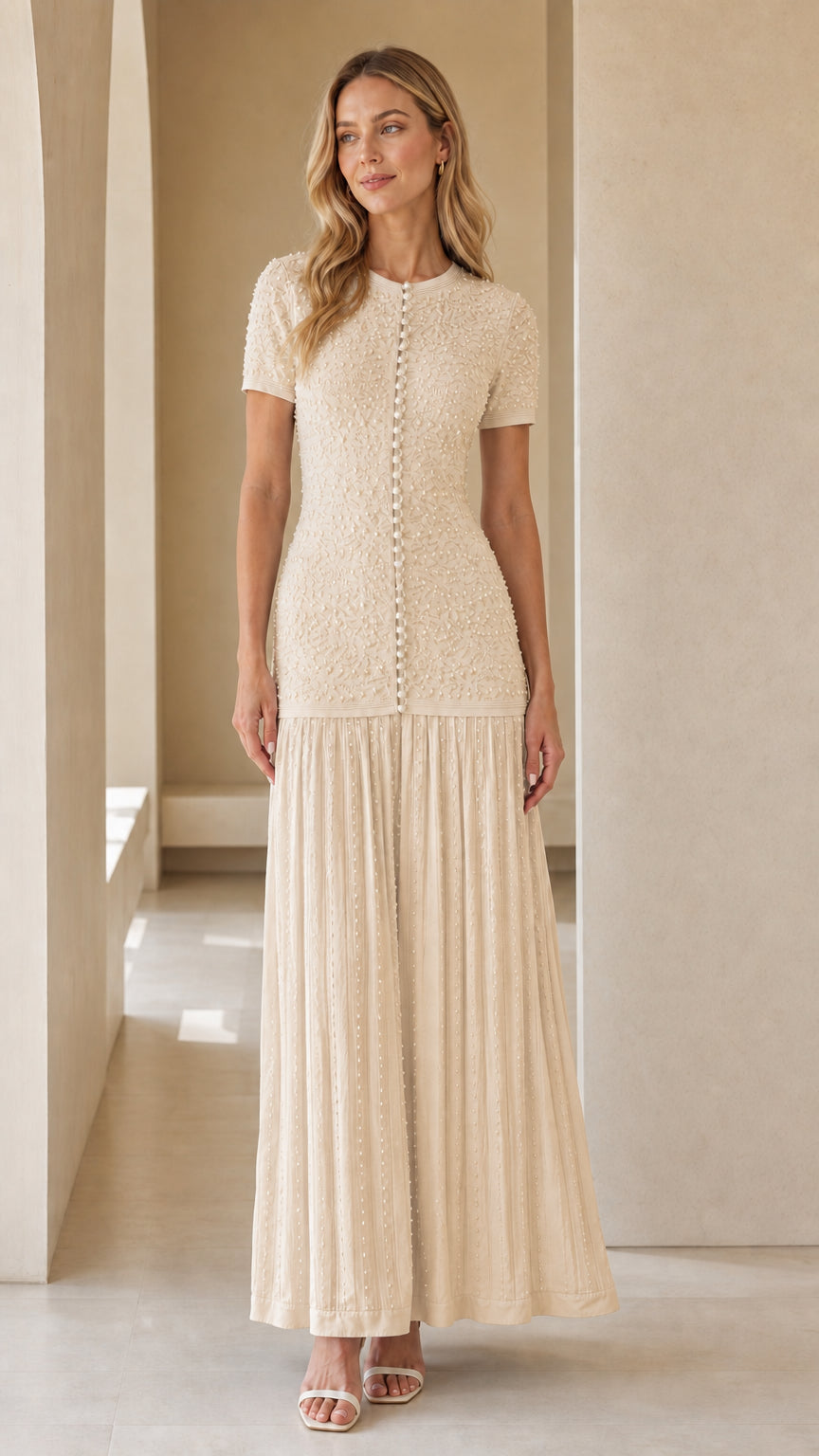 Front view of model wearing cream pearl-button textured knit maxi dress
