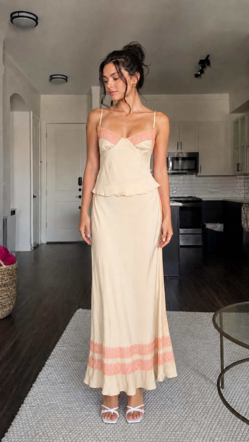 Model wearing champagne two-piece satin set