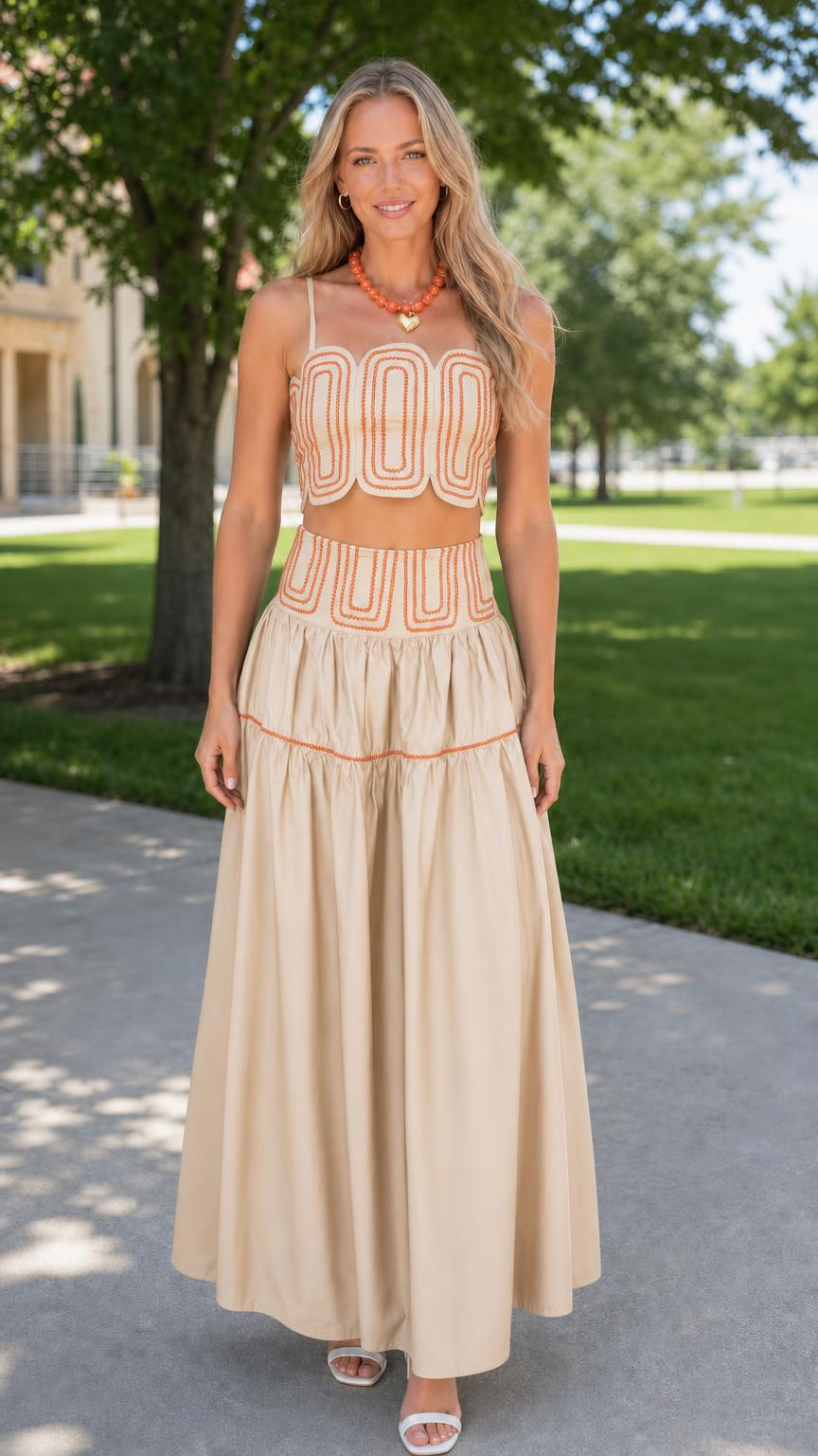 Front view of woman wearing khaki embroidered two-piece set