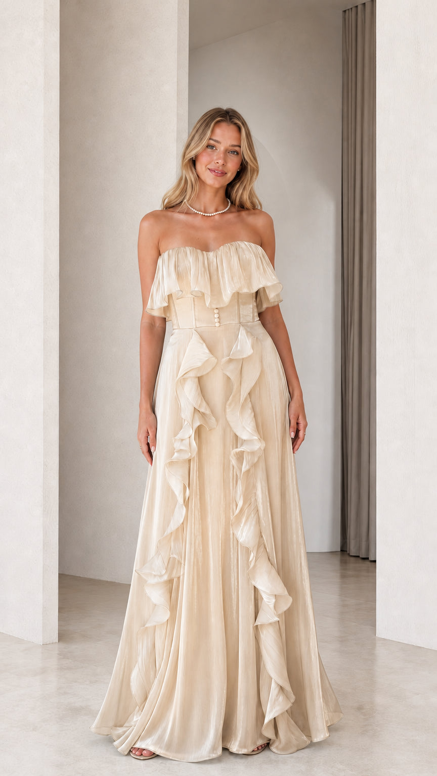 Front view of champagne strapless ruffled evening dress