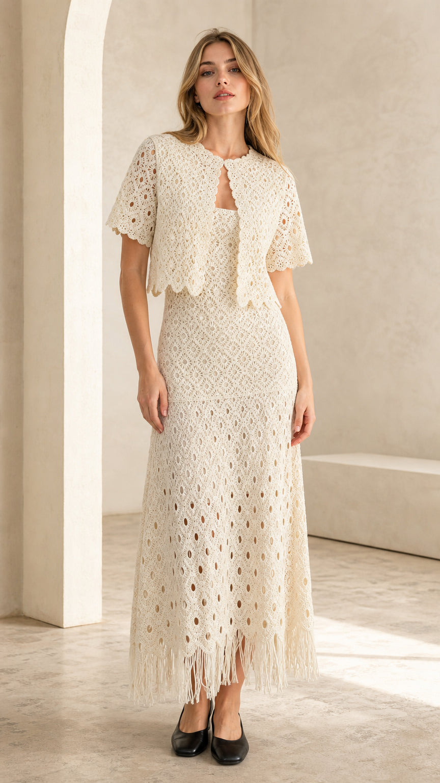 Front view of ivory crochet lace two-piece set on model