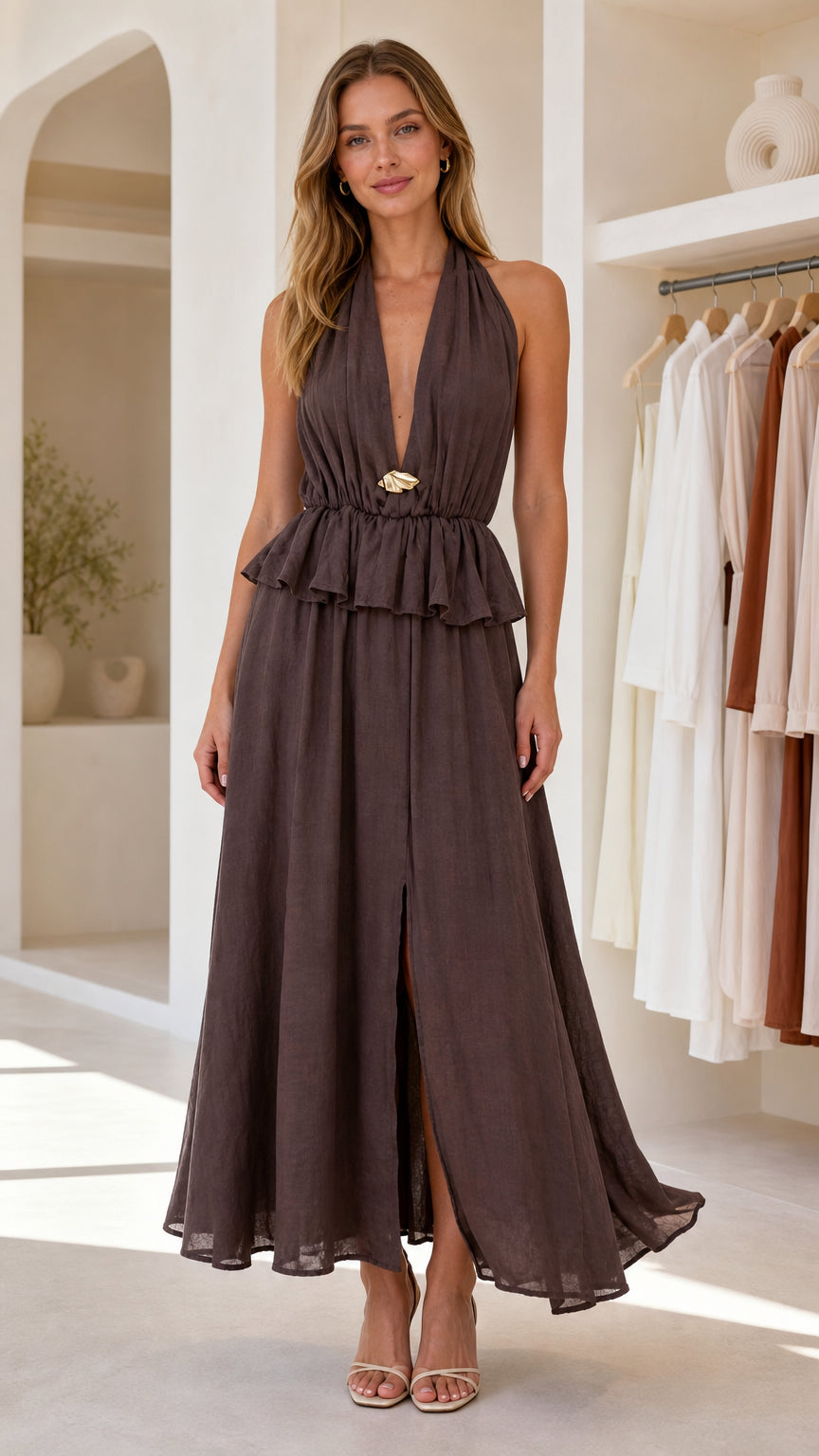 Front view of dark brown halter neck peplum maxi dress with front slit