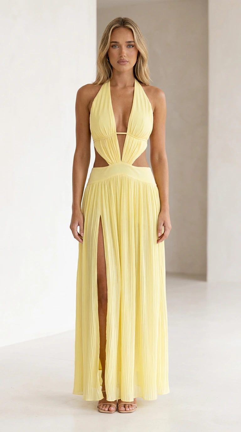 Front view of yellow halter neck cutout pleated maxi dress