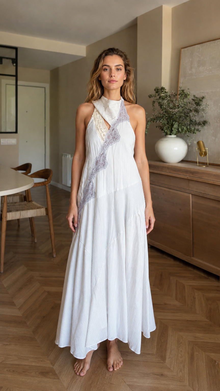 Front view of woman wearing white halter maxi dress
