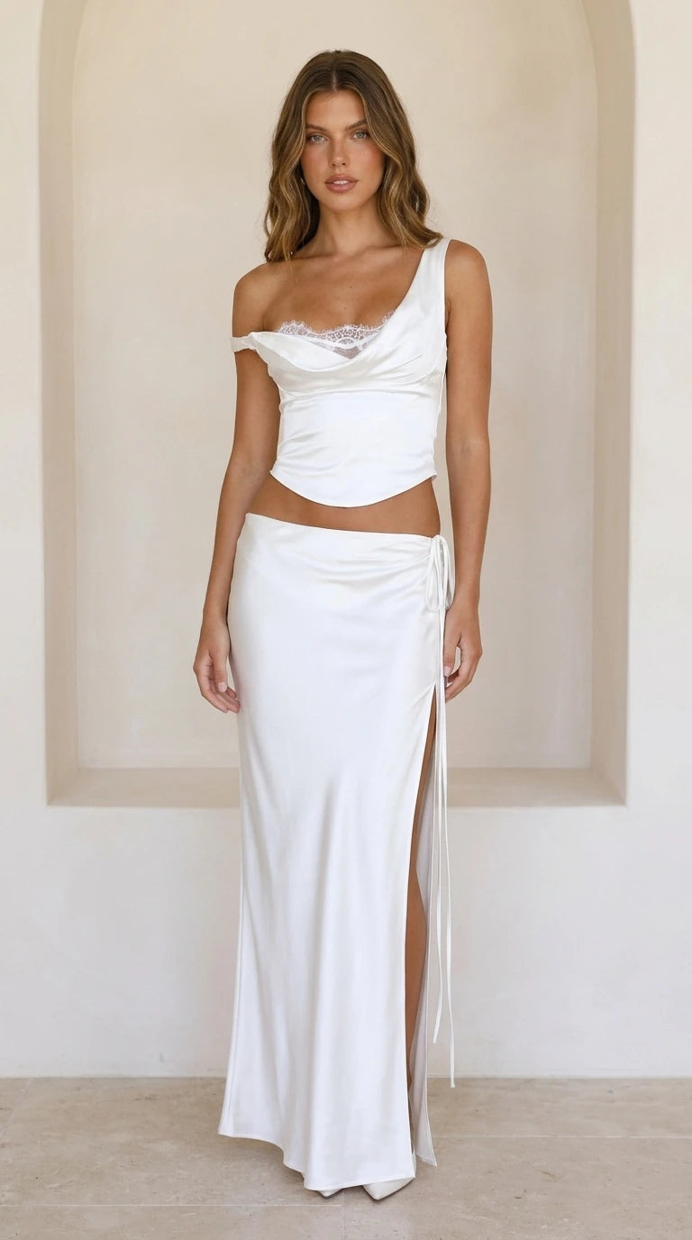 Front view of white satin lace-trim crop top and high-slit maxi skirt set