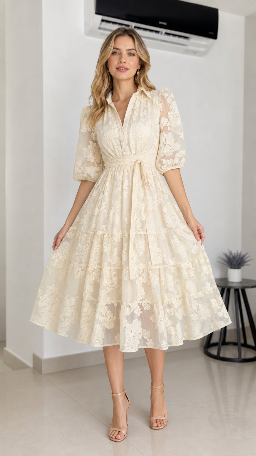 Front view of cream floral embroidered midi dress with belt