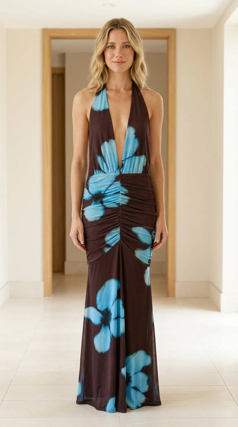 Front view of model wearing brown halter floral maxi dress