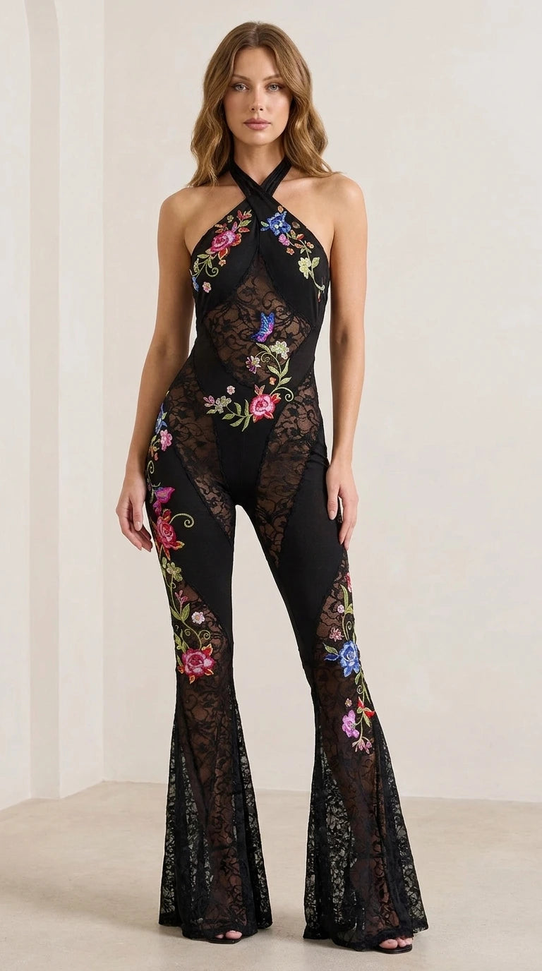 Front view of woman wearing black halter neck floral embroidered lace jumpsuit
