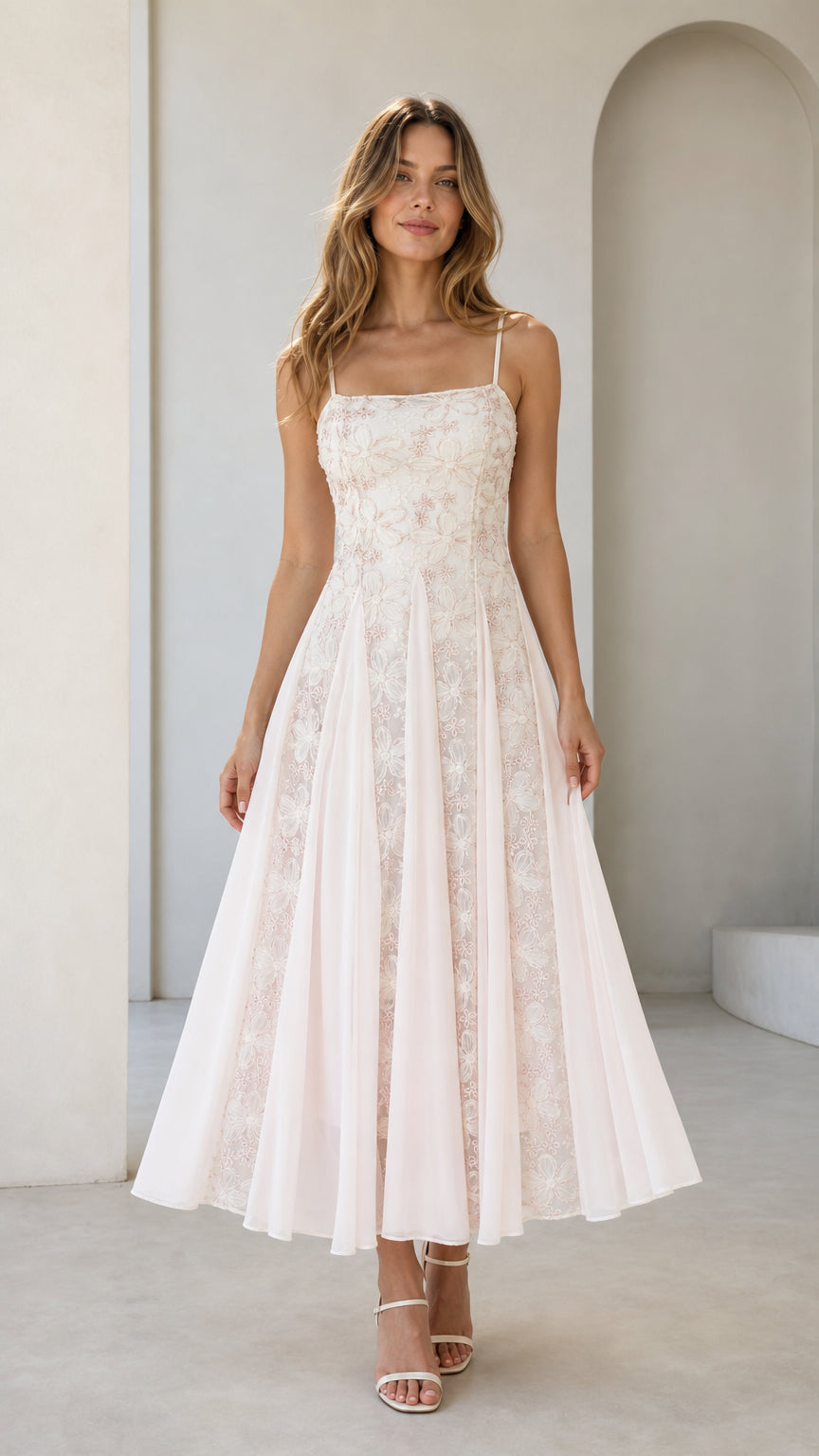 Front view of pink floral embroidered midi dress on model