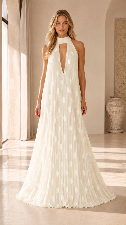 Ivory pleated halter maxi dress with deep V neckline and white dot pattern front view