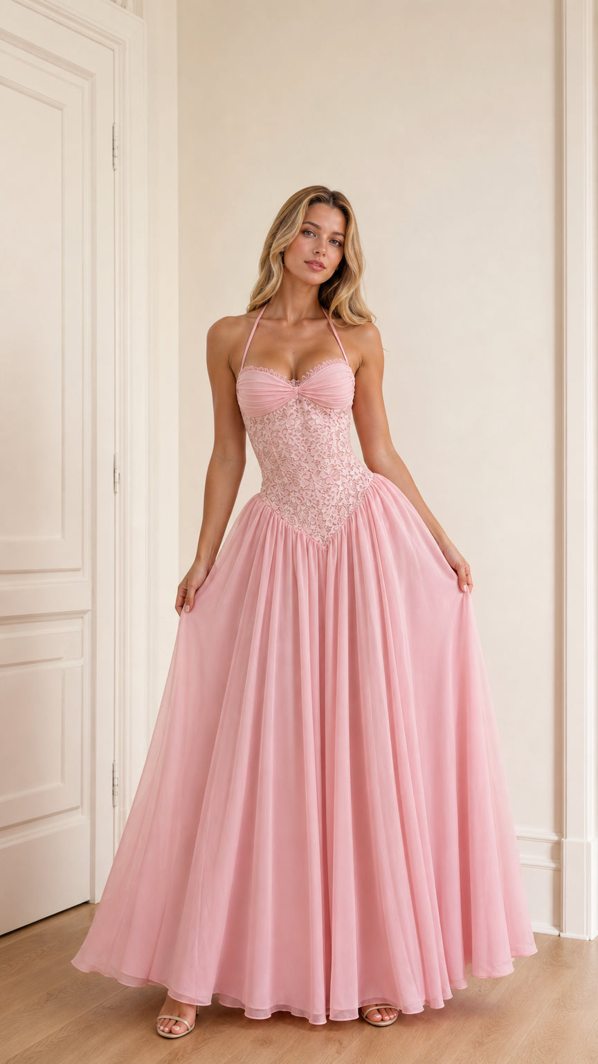 Model wearing pink halter neck lace corset long evening dress front view