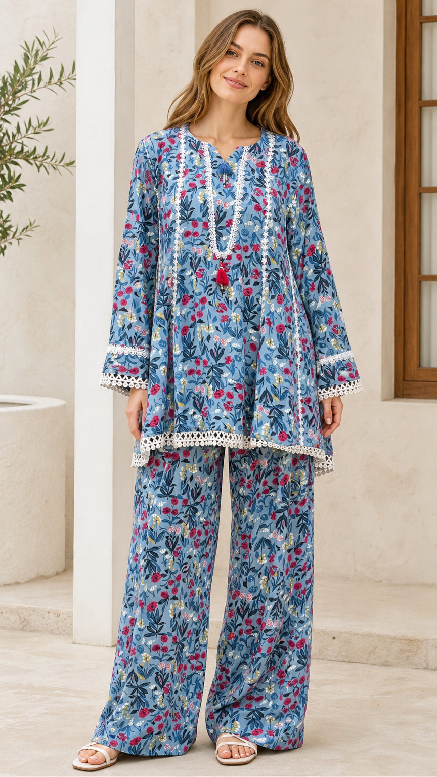 Model wearing blue floral tunic and wide-leg pants set front view