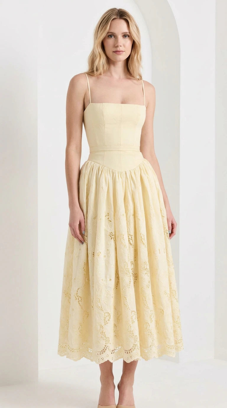 Front view of model wearing yellow sleeveless square neck embroidered midi dress