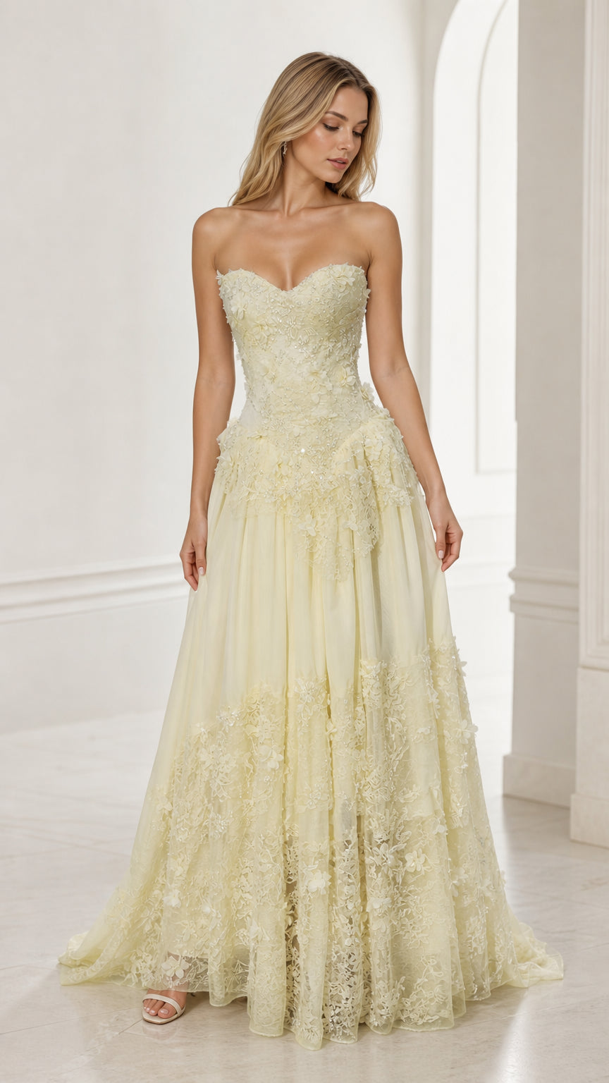 Front view of yellow strapless floral applique ball gown