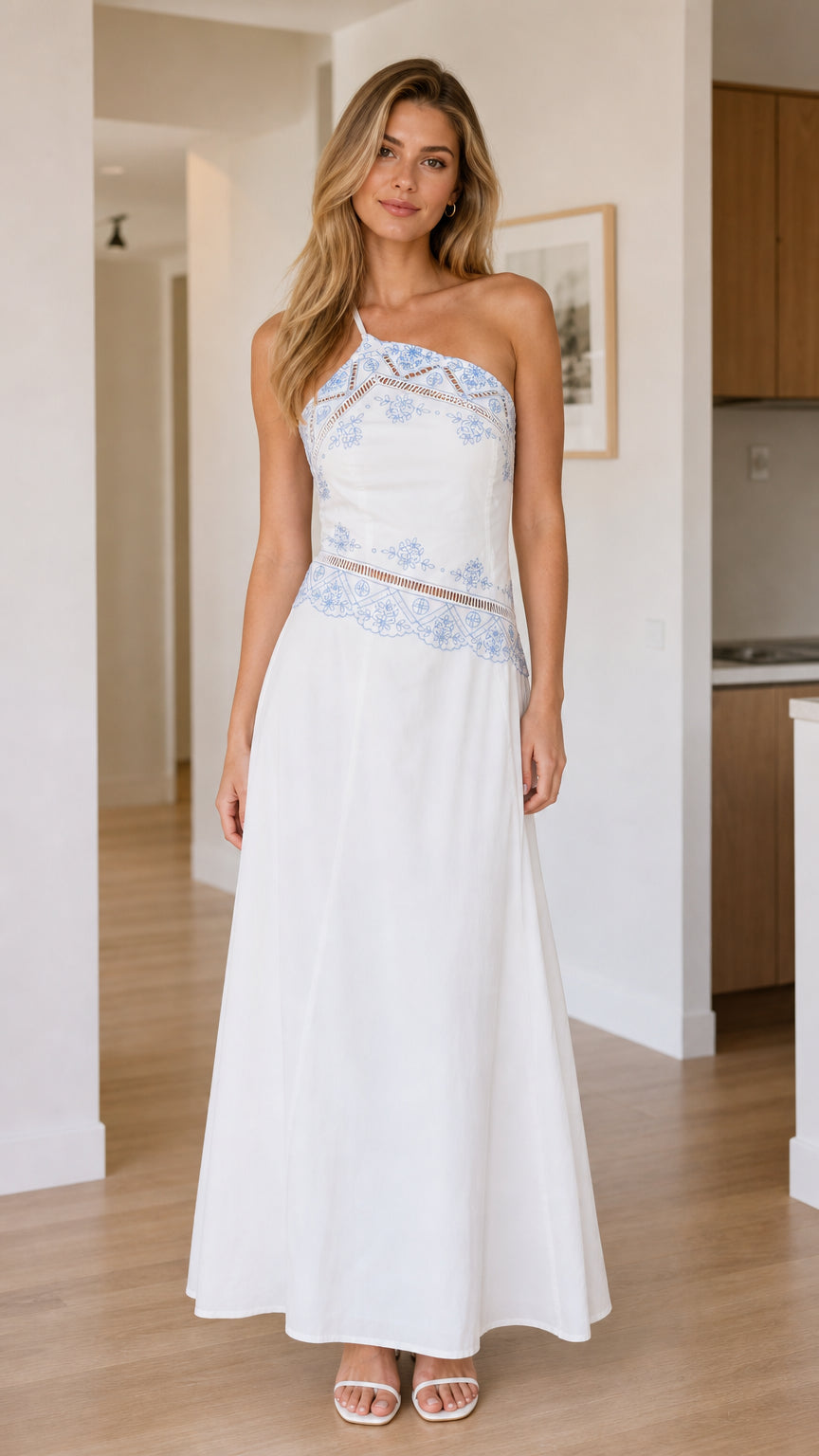 Front view of white one-shoulder embroidered maxi dress