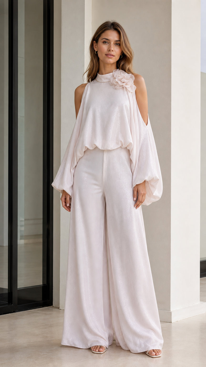 Front view of elegant white cold-shoulder blouse and wide-leg pants set