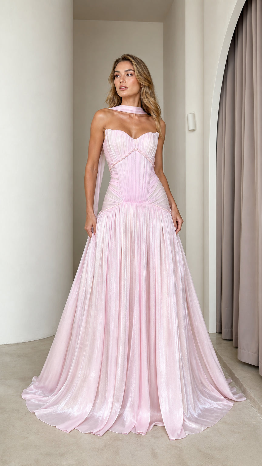 Front view of model wearing pink pleated strapless maxi dress
