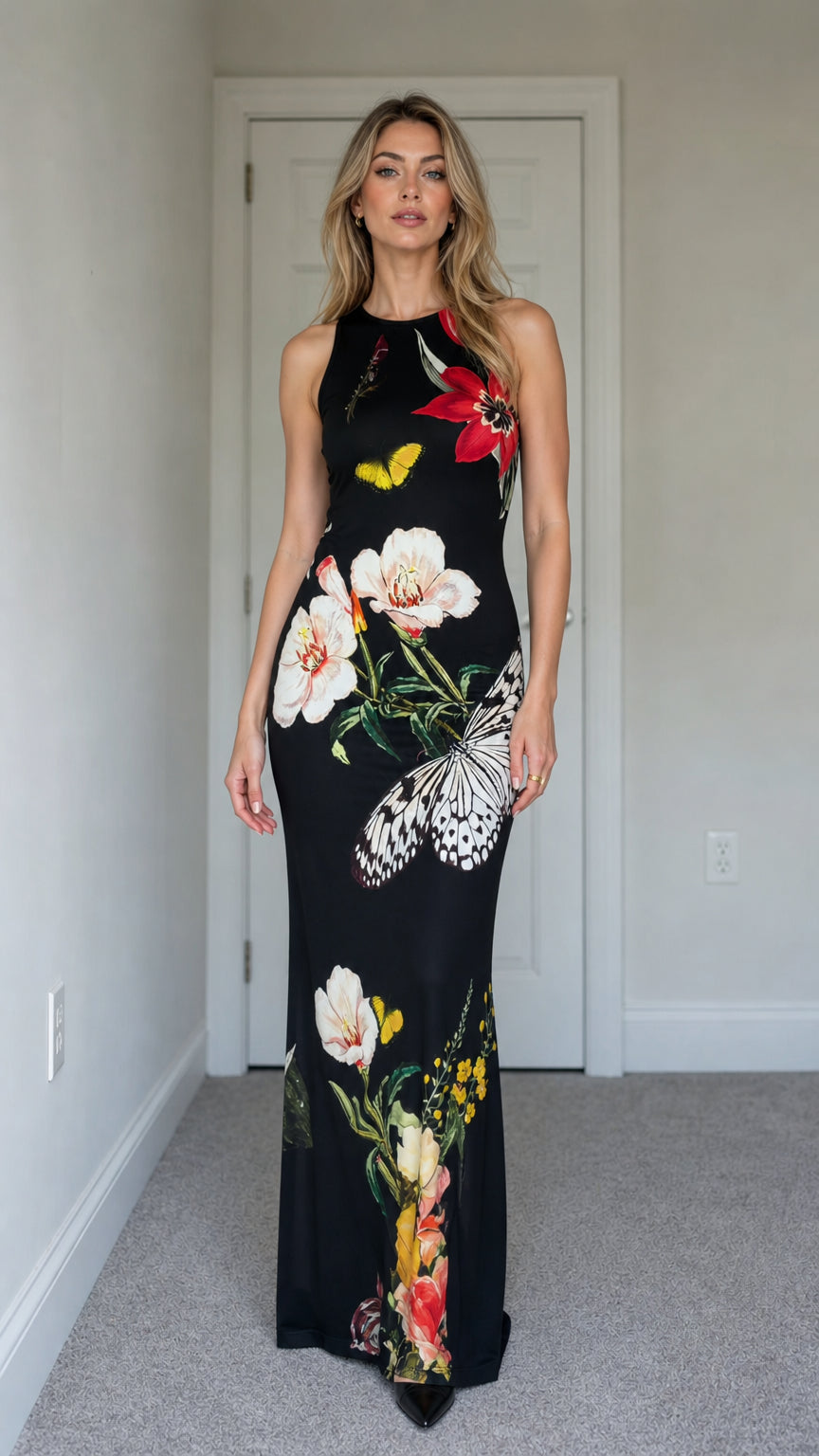 Model wearing black floral butterfly print sleeveless maxi dress from the front