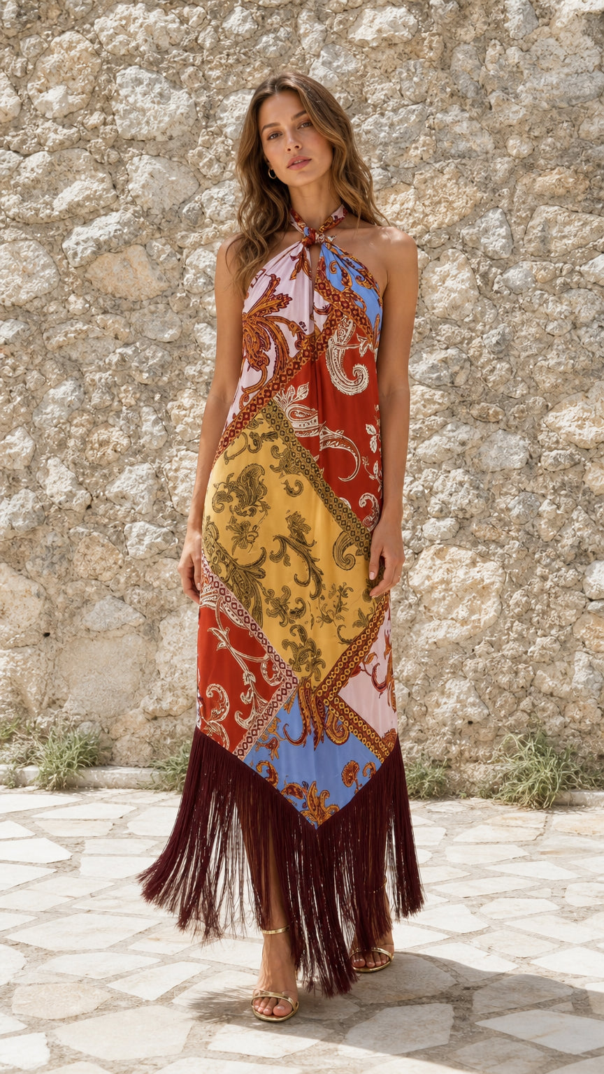 Front view of model wearing Multicolor paisley halter fringe maxi dress