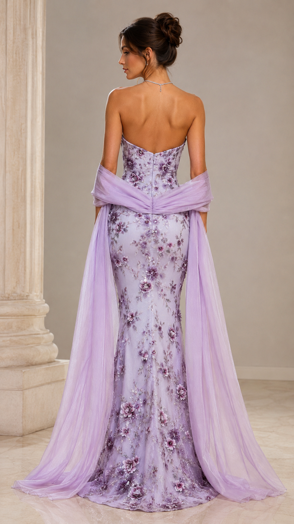 Back view of lilac strapless floral mermaid evening gown with flowing sheer shawl