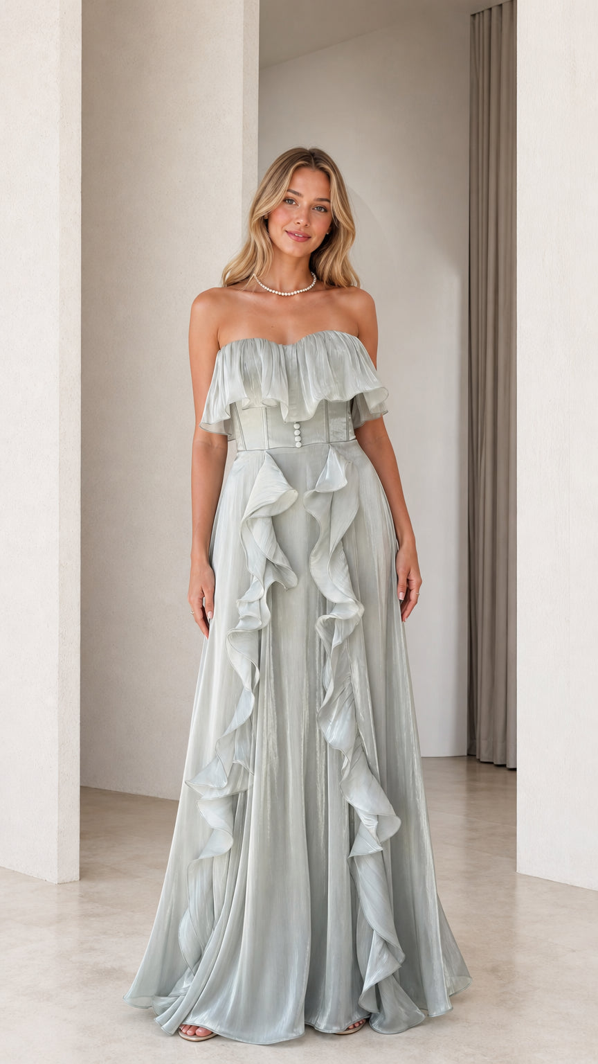 Front view of model wearing sage green strapless ruffled evening dress