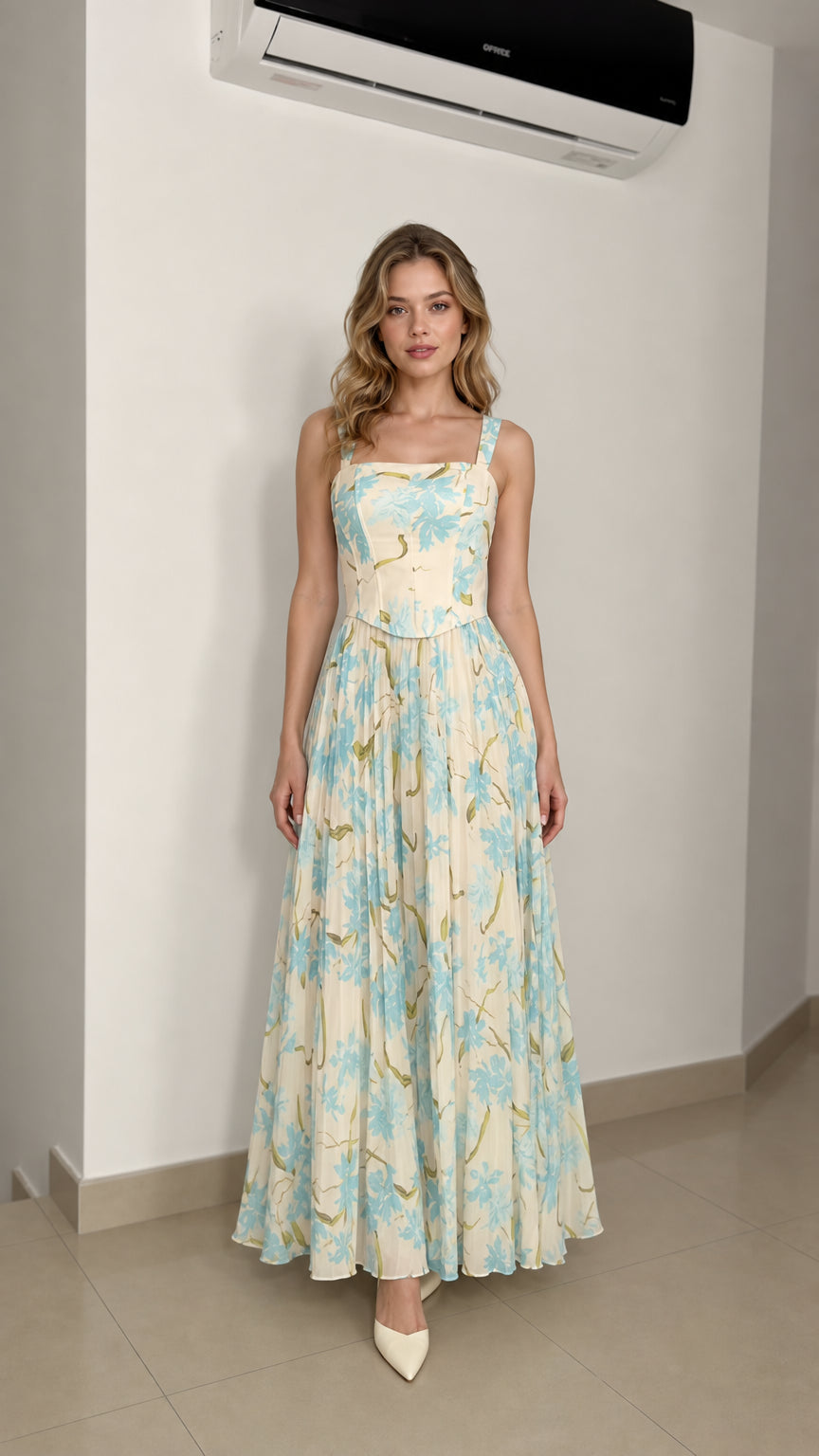 Model wearing ivory floral maxi dress from the front