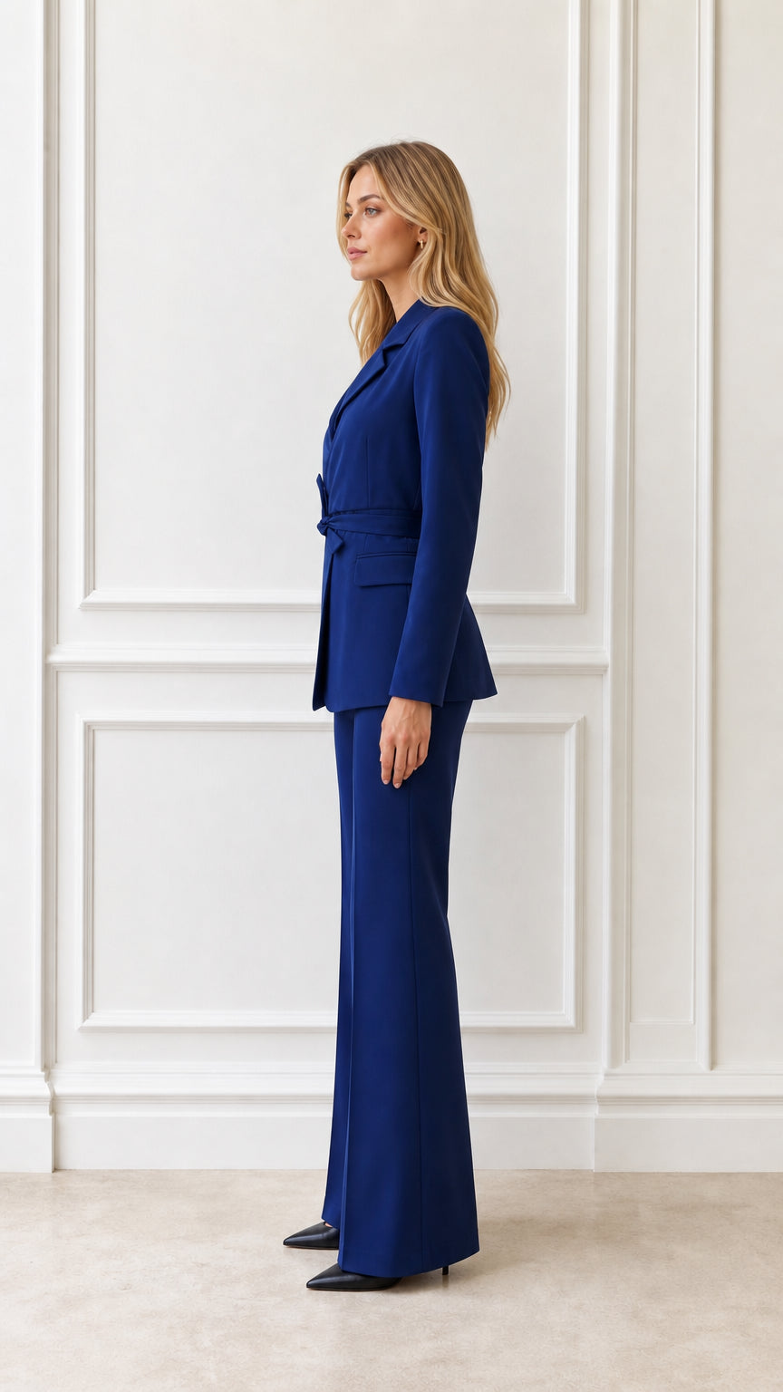 Side profile of woman in royal blue two-piece pantsuit