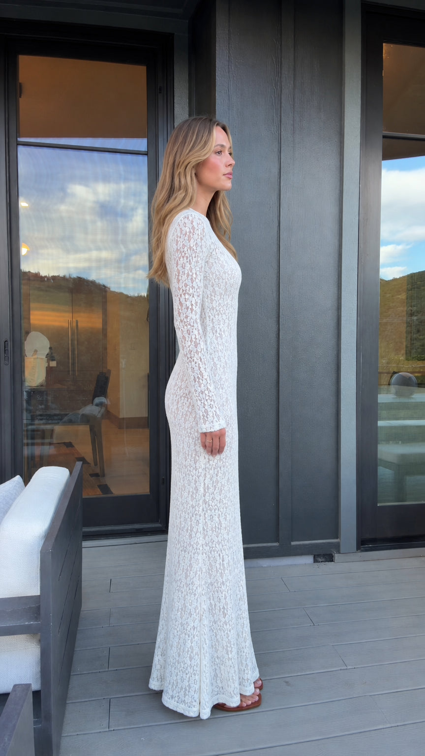 Side profile of woman wearing white lace dress