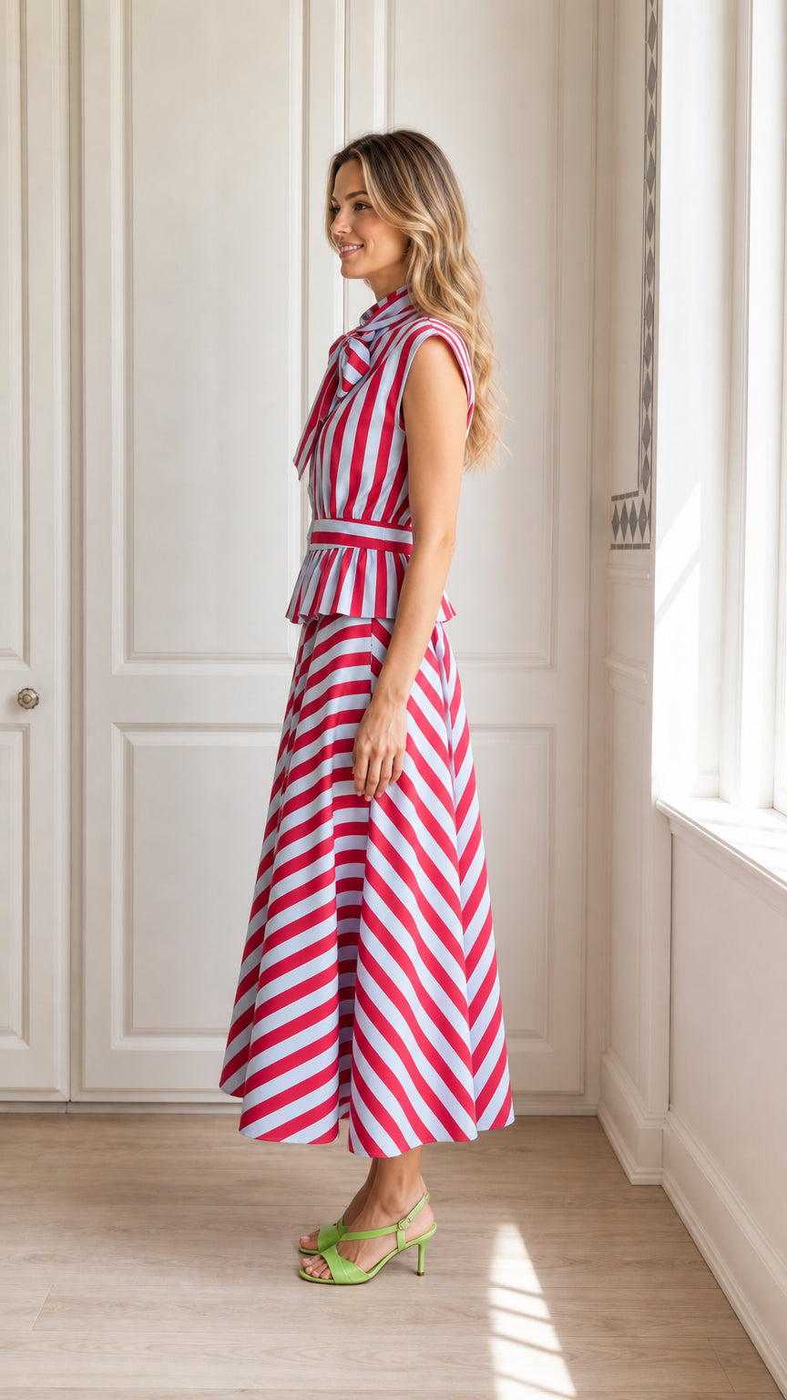 Side view of model in red striped midi dress