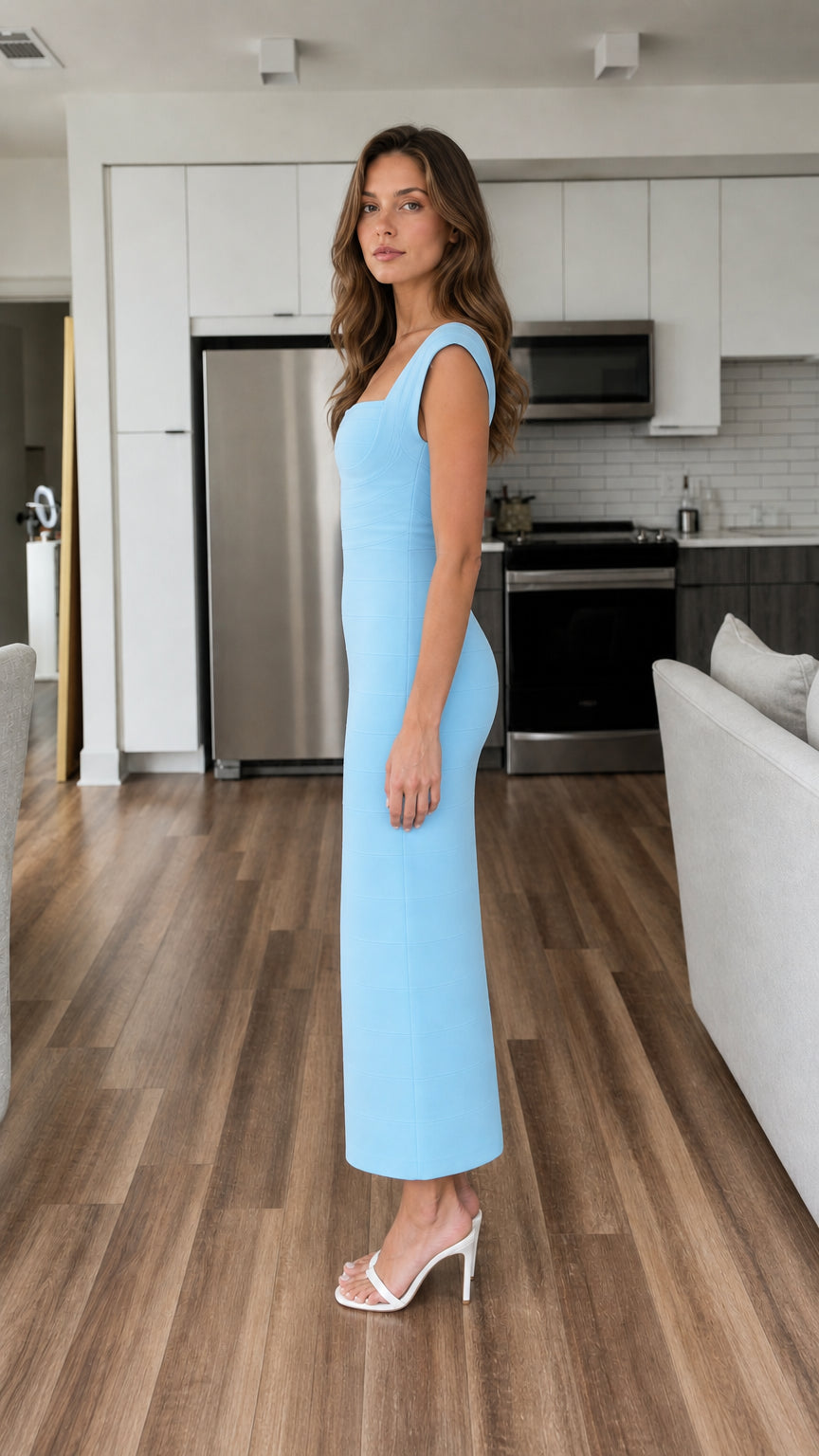 Side profile of model wearing light blue midi dress