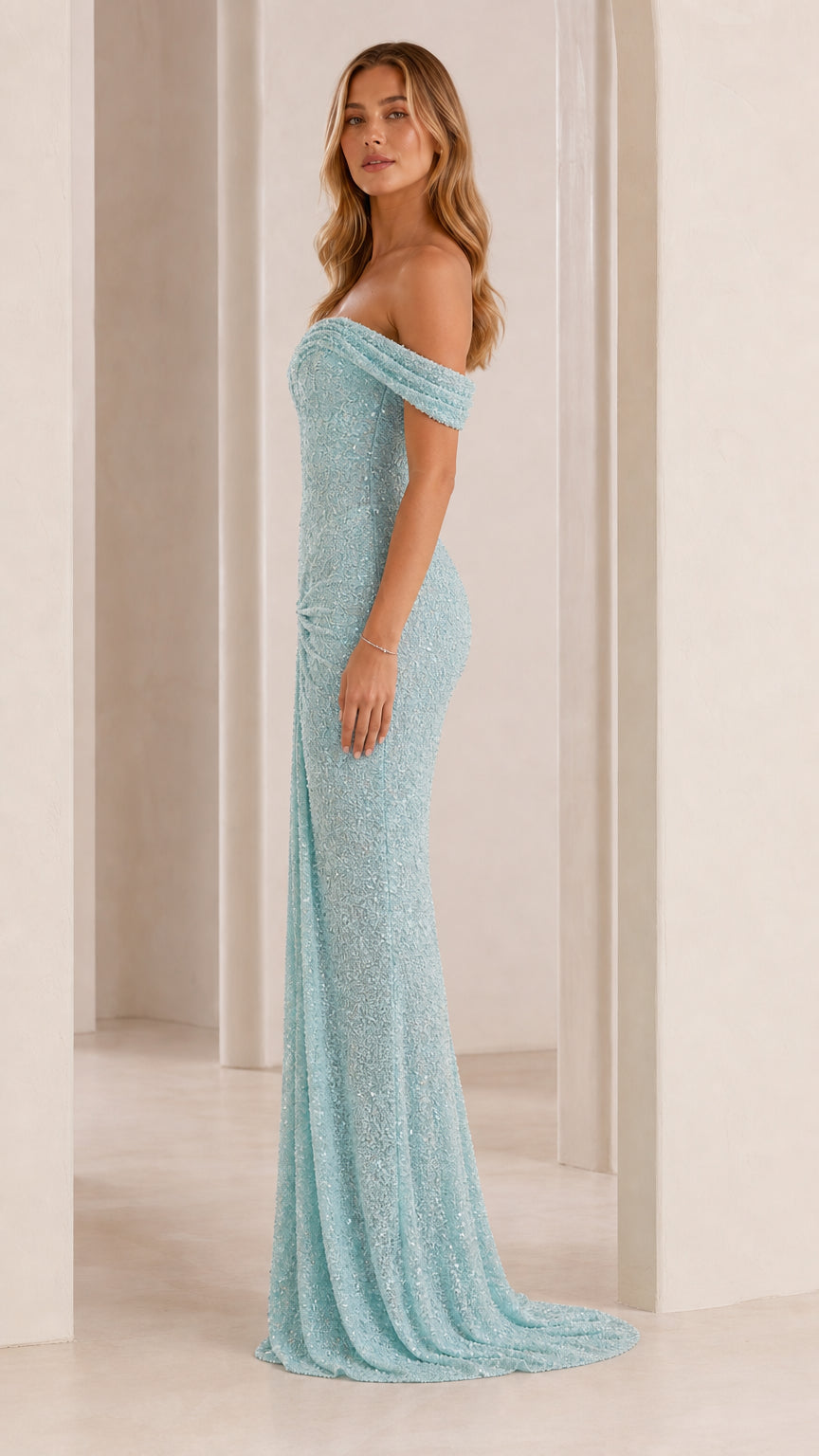 Side profile of model in light blue sequin evening dress