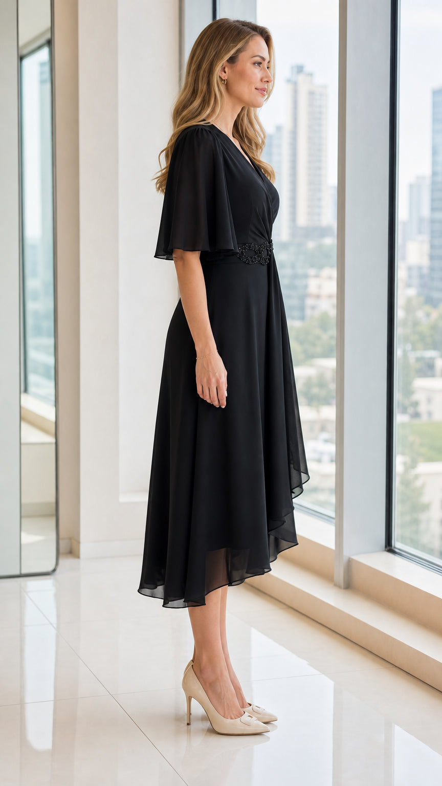 Side profile view of black V-neck chiffon midi dress