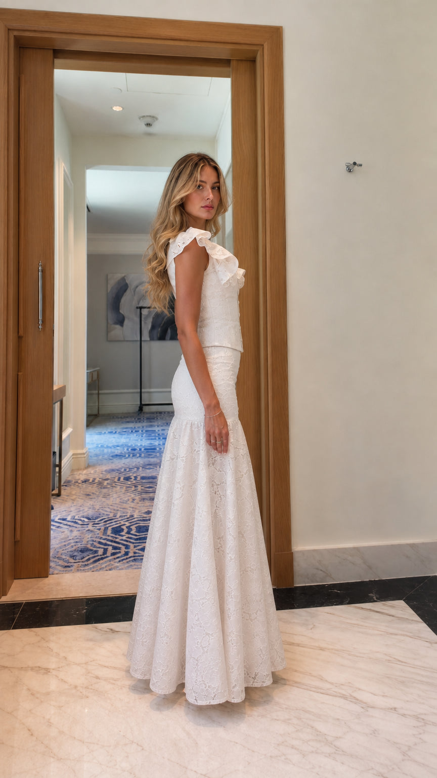 Model wearing white lace matching set, side profile view