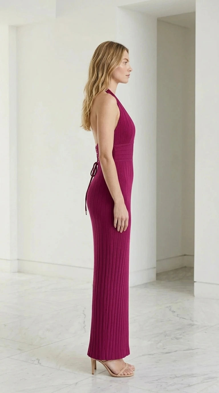 Side profile view of magenta halter dress