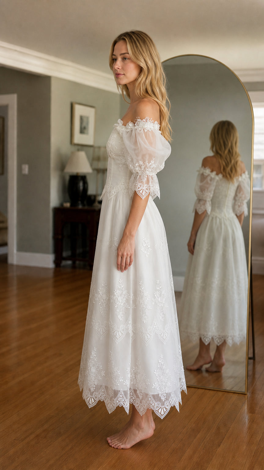 Side view of woman wearing white off-shoulder embroidered midi dress