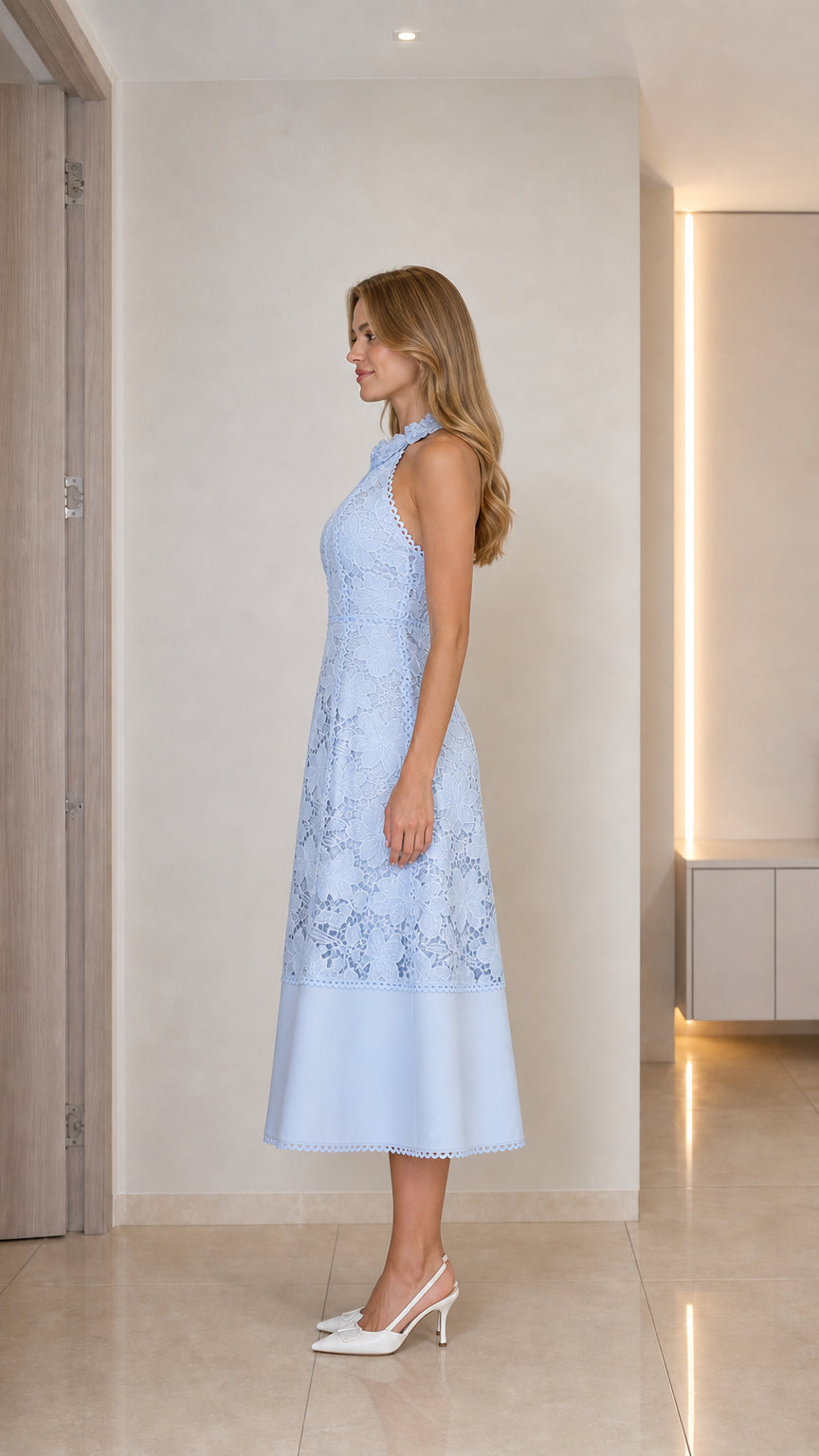 Model wearing light blue lace midi dress side view