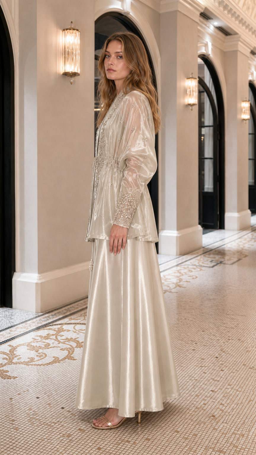 Side profile view of champagne two-piece set in a hallway