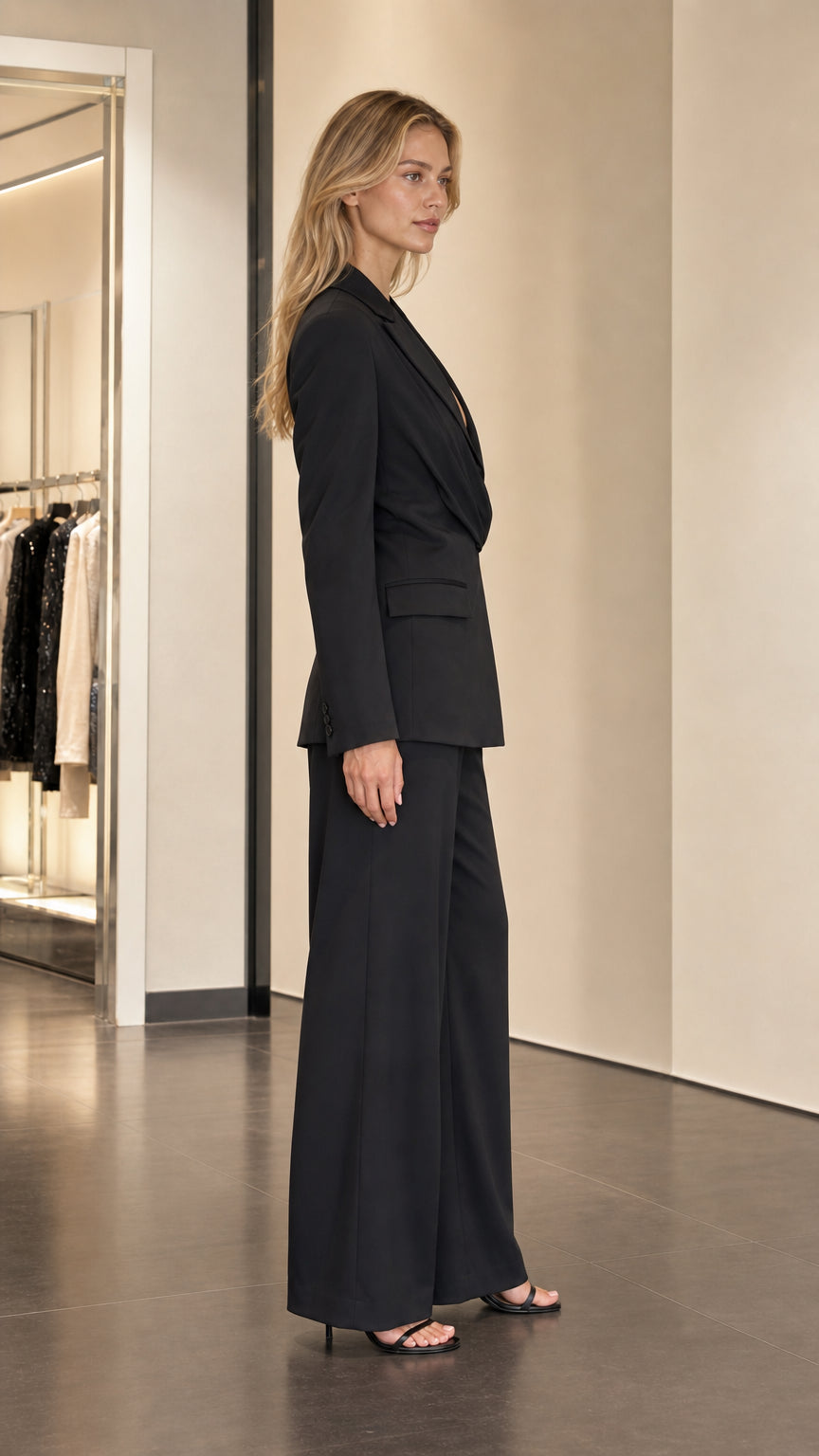Side profile of black tailored suit set