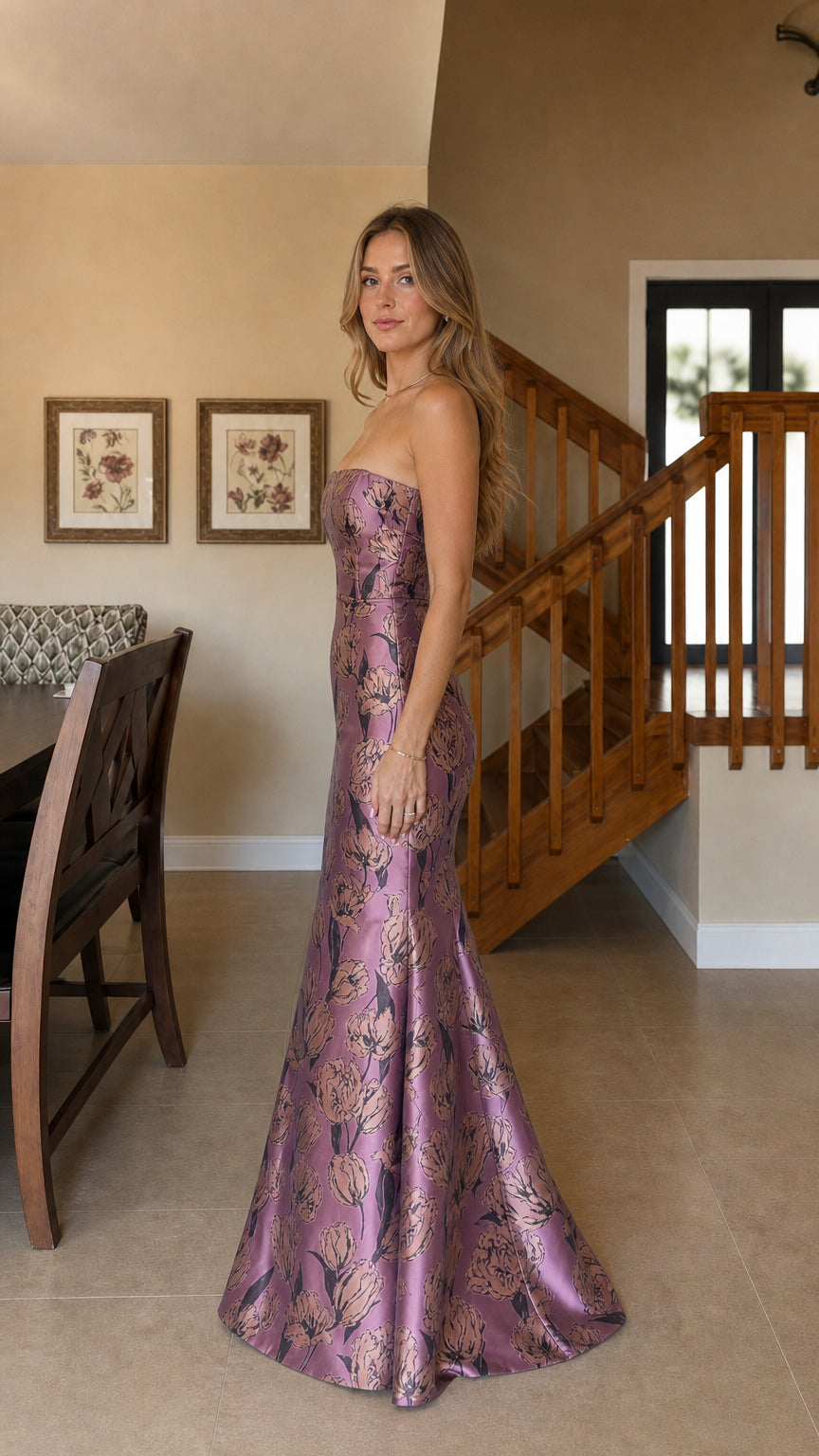 Model wearing purple strapless floral jacquard mermaid evening dress, side profile