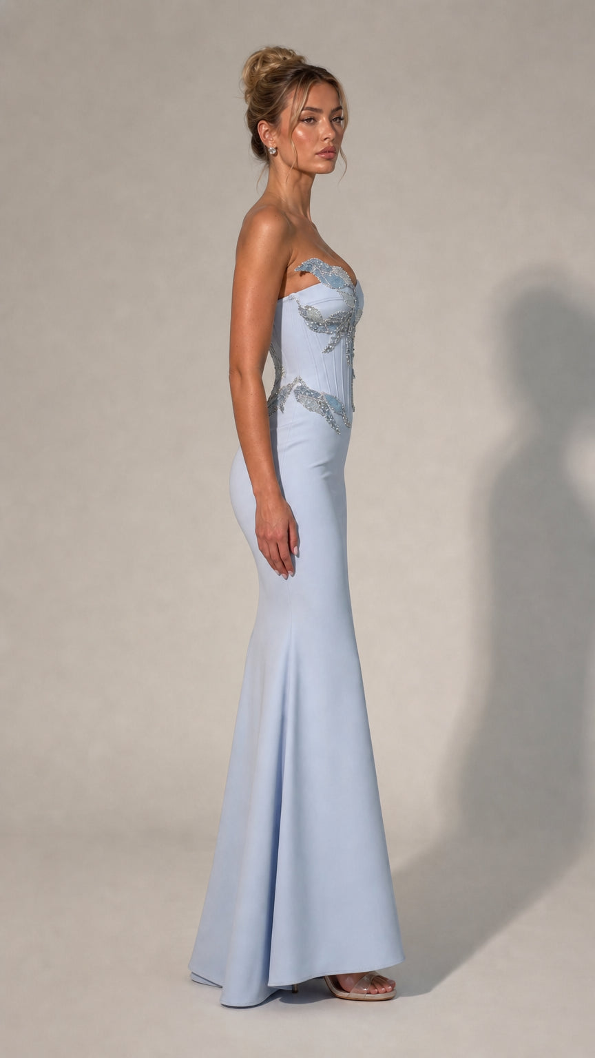 Side profile of light blue strapless evening dress